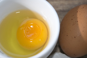 shelled white egg and yolk