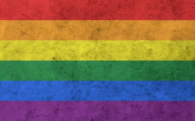 gay rainbow flag on concrete wall surface
