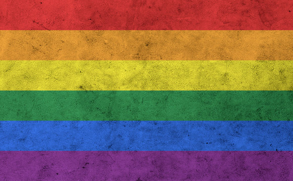 gay rainbow flag on concrete wall surface