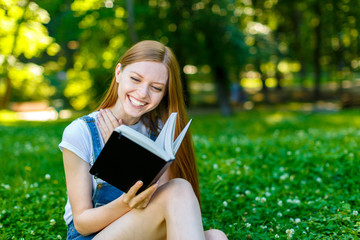 Fototapeta premium Beautiful smiling red-haired young woman