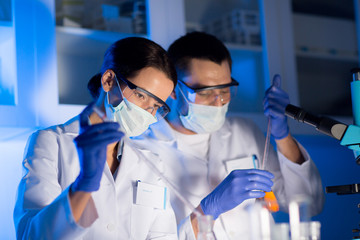 close up of scientists making test in lab