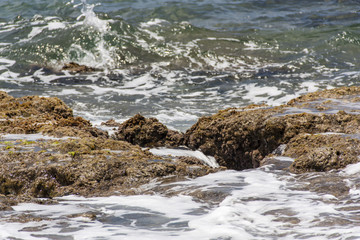 Sea wave hit the rock