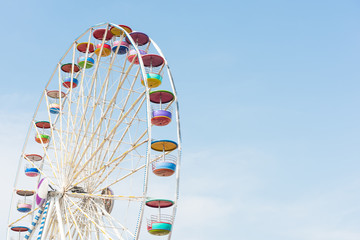 colourful ferris wheel with blue sky