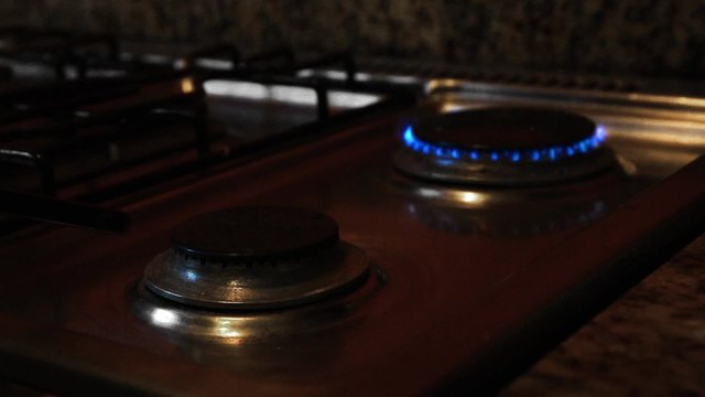 Ignite on gas stove at the kitchen, closeup
