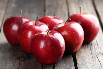 Ripe red apples on table close up