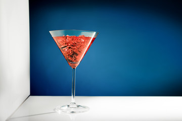 Martini glass on a blue background