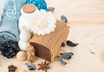 spa stuff, cinnamonand flower with towel on wood
