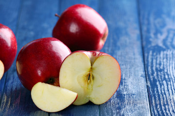 Ripe red apples on table close up