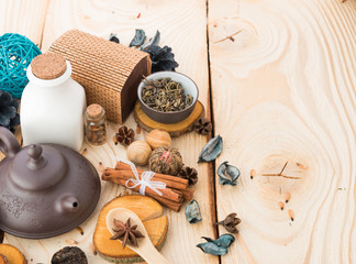 dry tea leaves cinnamon and on wooden background