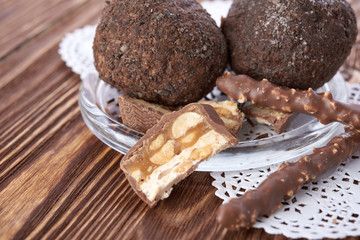 Cupcake with chocolate on wooden background