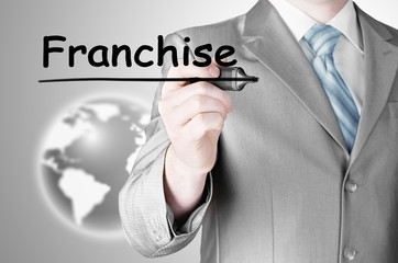 business man writing franchise