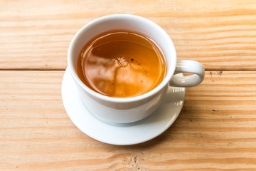 Tea cup on the wood floor