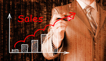 business man drawing graph of sales