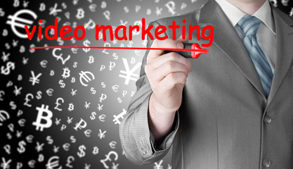 business man writing Video Marketing