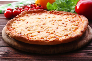 Cheese pizza with vegetables on table close up