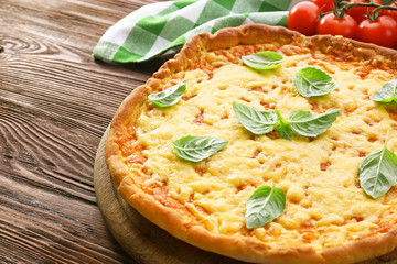 Cheese pizza with cherry tomatoes on table close up