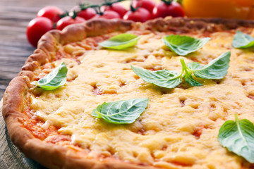 Cheese pizza with vegetables on table close up