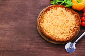 Cheese pizza with vegetables on table close up