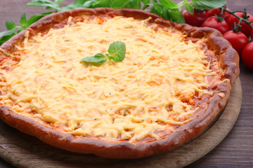 Cheese pizza with cherry tomatoes on table close up