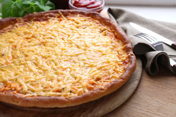 Tasty cheese pizza on table close up
