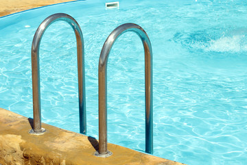 Irony ladder to the pool and part of the pool