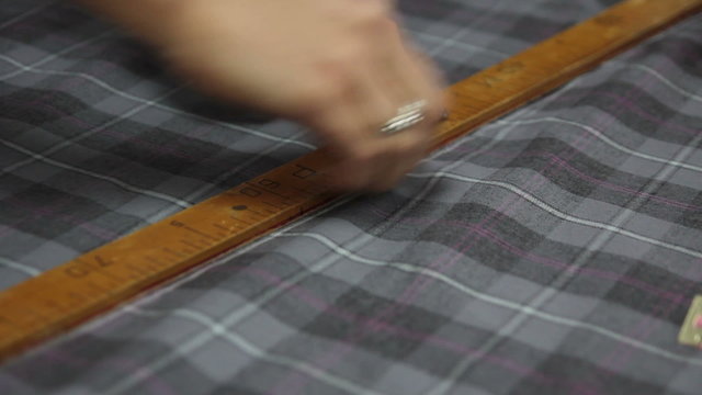 seamstress makes cutting work