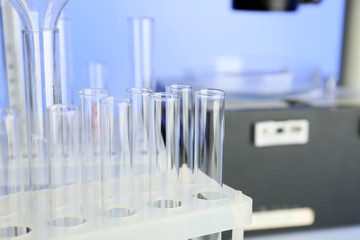 Test tubes and microscope in laboratory