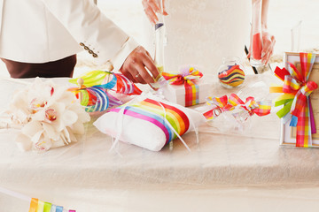 beautiful  gorgeous blonde bride  and stylish groom, hawai  colorful sand ceremony  on cyprus