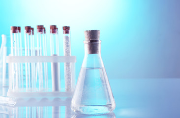 Empty laboratory test tubes  on blue background