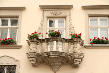Fototapeta na wymiar Old balcony with flowers in pots