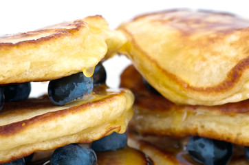 Delicious pancakes close up, with fresh blueberries and maple sy