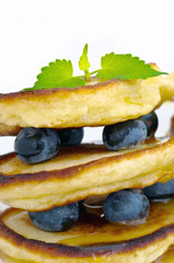 Delicious pancakes close up, with fresh blueberries and maple sy
