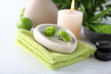 Beautiful composition of spa treatment on white wooden table