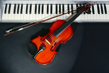 Violin and piano on dark background