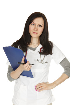Healthcare professional with clipboard and stethoscope looking at viewer.