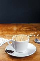 Coffee with a cookie on the wood table