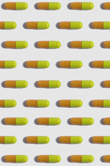 pills / capsules geometric pattern isolated on white background