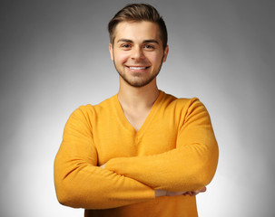 Handsome man on gray background