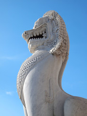 The over 150 years ancient marble lion standing at front of main temple 