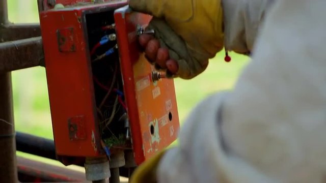 Worker operating a machine outside
