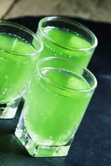 Green cocktail witn gin and mint, selective focus