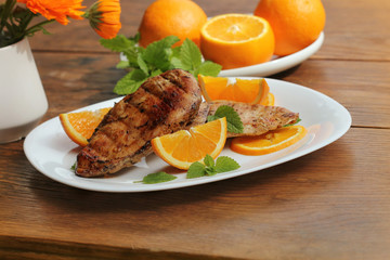 Grilled chicken breast with orange and mint