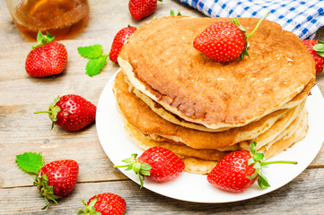 pancakes with fresh berries and honey