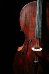 Vintage cello on dark background