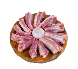 raw ribs and garlic. view from above