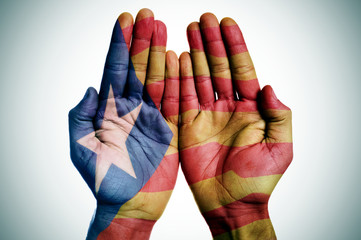 man hands patterned with the Catalan pro-independence flag