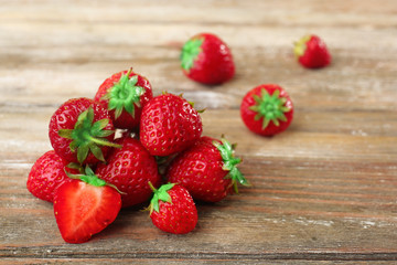 Ripe strawberries on wooden table, closeup