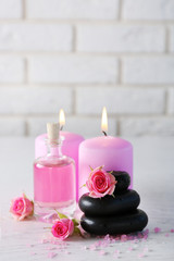 Beautiful composition of spa treatment on white wooden table