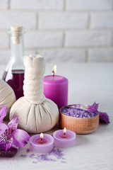 Beautiful composition of spa treatment on white wooden table