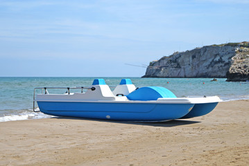 Fototapeta premium pedal boats on the beach